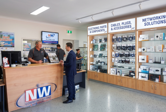 Inside the NW Communications store, showing electronic parts and accessories shelving