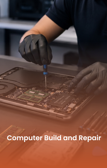 Technician repairing an open laptop's internal components